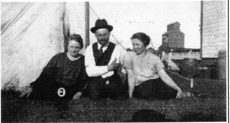 Anastasia and Nicholas Hryhorczuk and sister Mary Dzaman in backyard of home in Ethelbert.